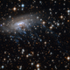 Illustration for article titled Haunting new Hubble image shows a galaxy being ripped to shreds